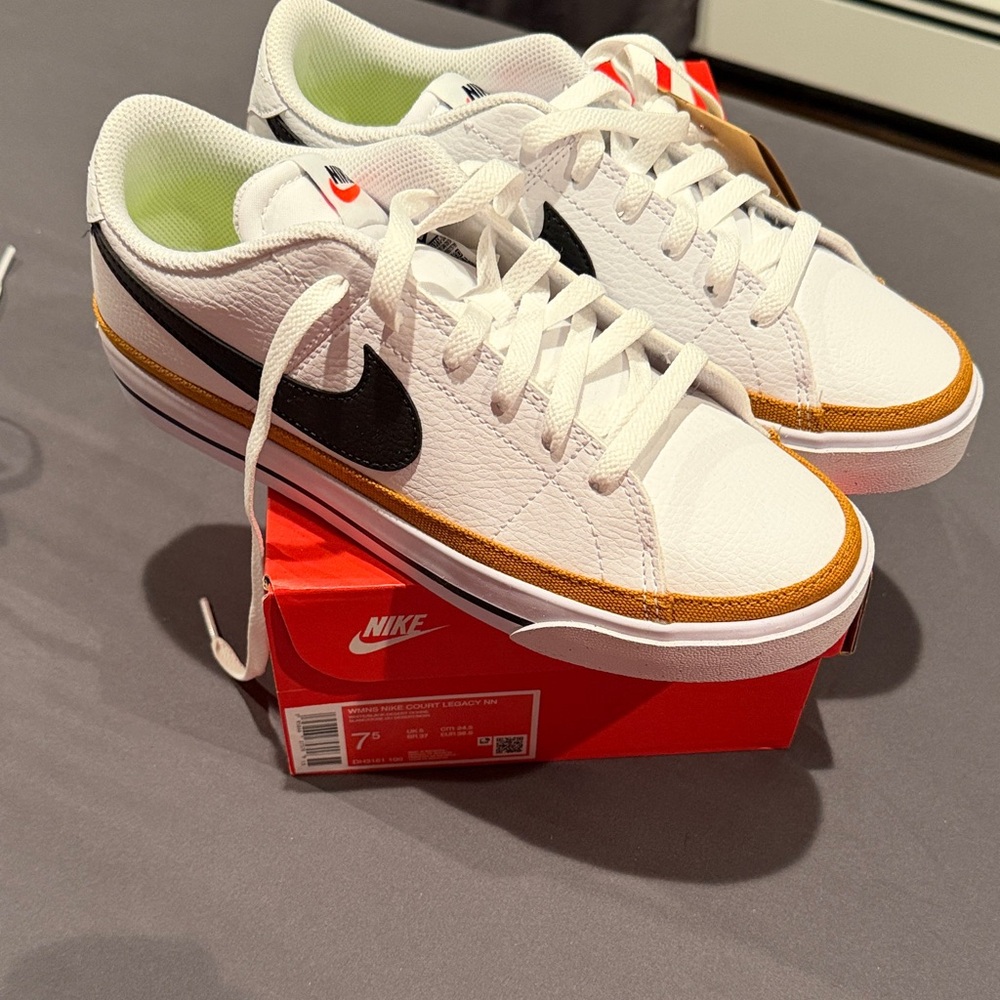 Nike White Leather Low-Top Sneakers with Black Swoosh and Brown Trim